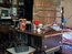 Самодельные столик, электронагреватель из старого глянцевателя и шкаф (на заднем плане), изготовленные моим батей.